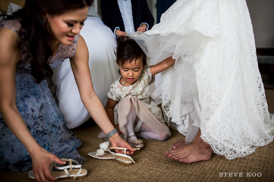 girl-helping-put-on-bride-shoes